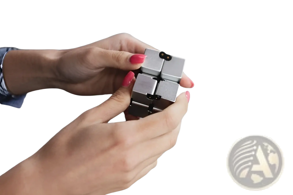 Silver metallic infinity cube fidget toy with black circular indentations made of zinc alloy for stress relief