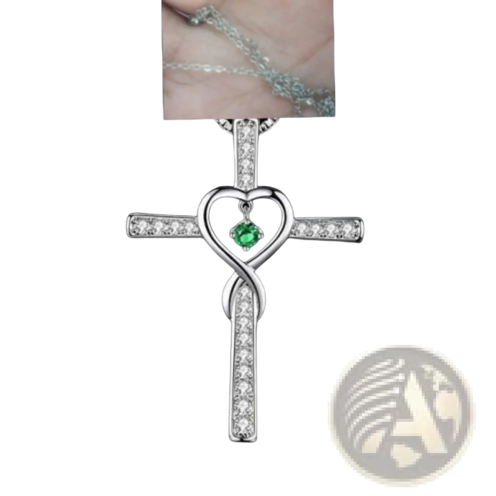 Silver cross pendant necklace with a heart-shaped center green gemstone and clear crystal accents titled Infinity Love Heart Cross Birthstone Crystal Necklace
