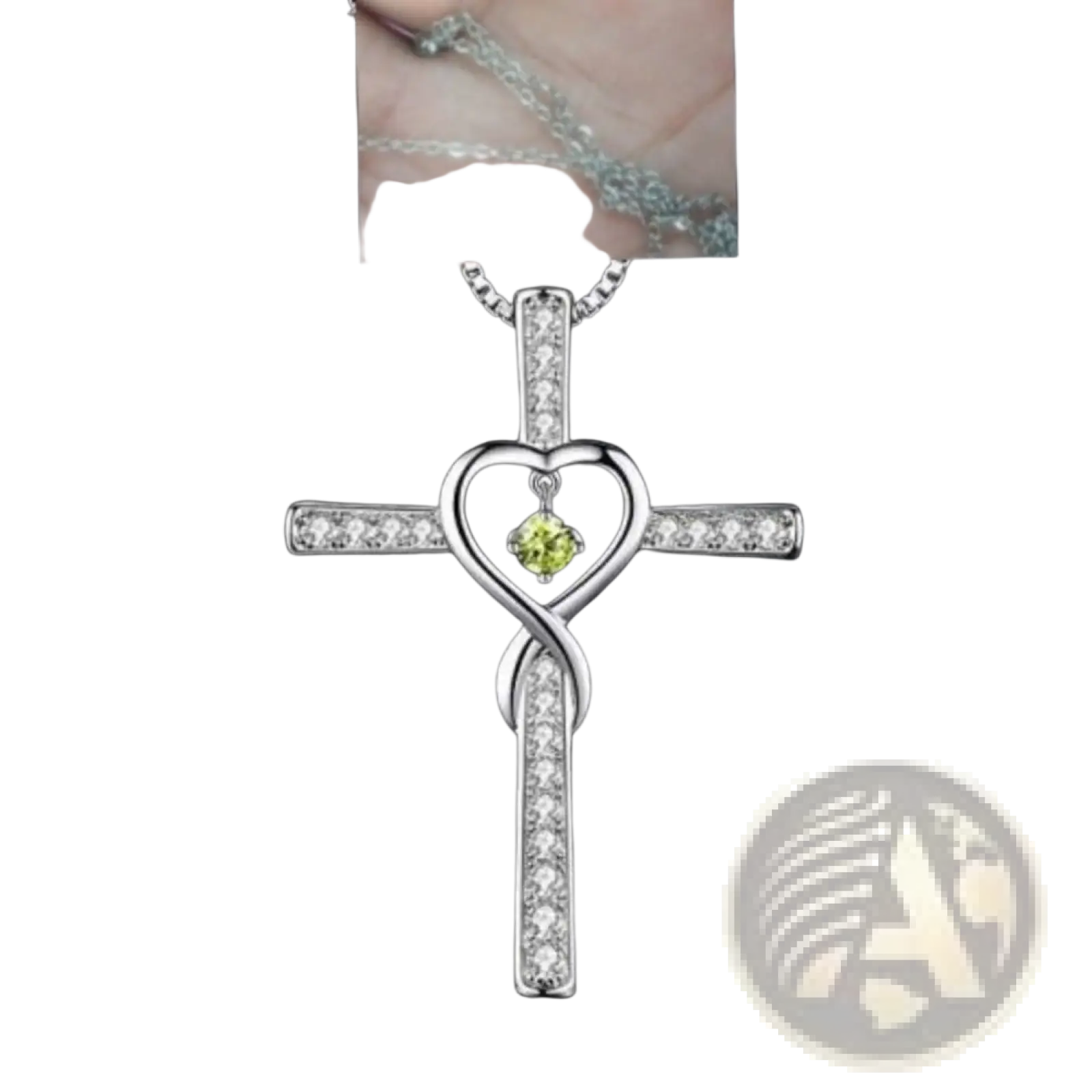 Silver cross pendant necklace with heart-shaped green birthstone center and clear crystal accents infinity love design