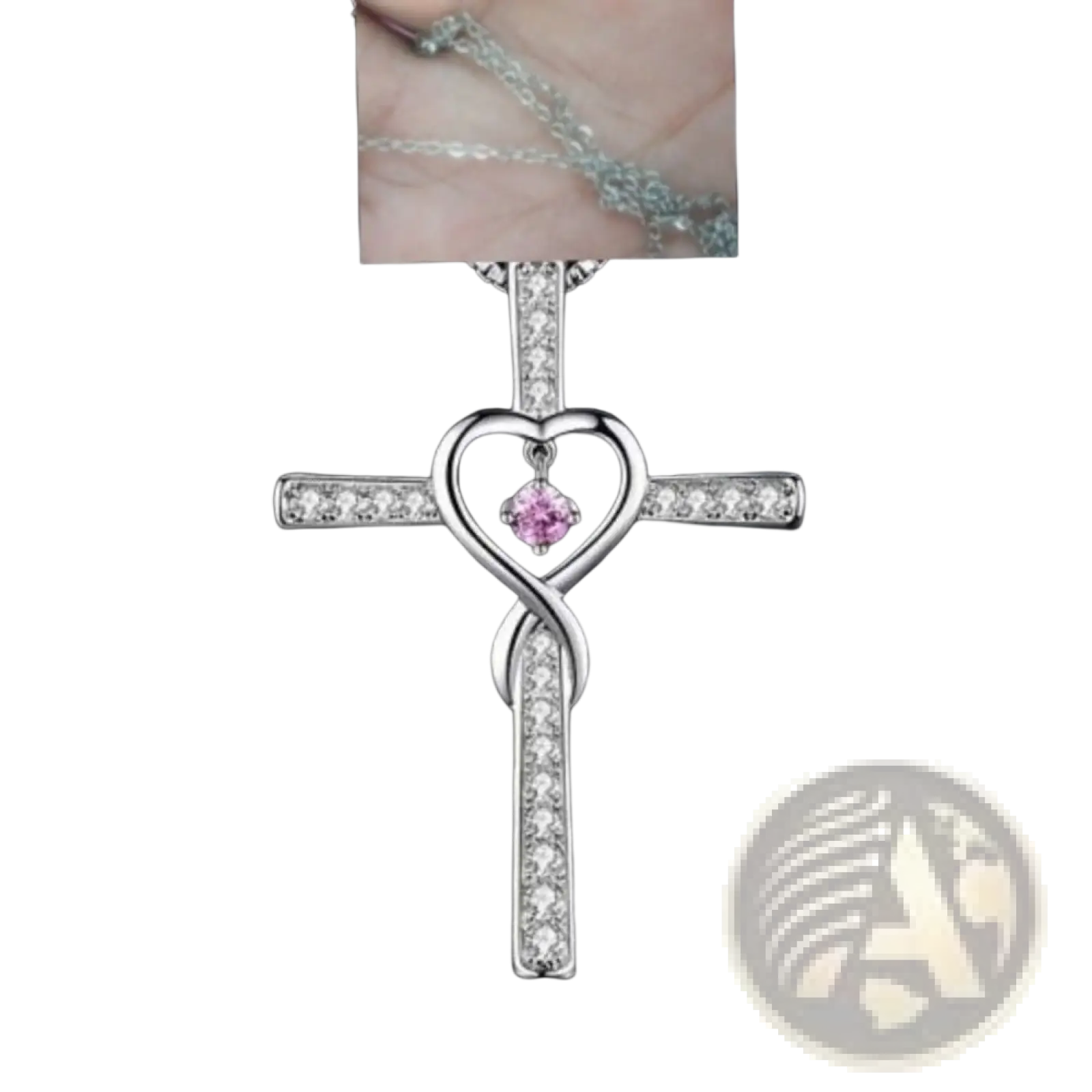 Silver cross pendant necklace with heart-shaped center pink gemstone and clear crystal accents in infinity design
