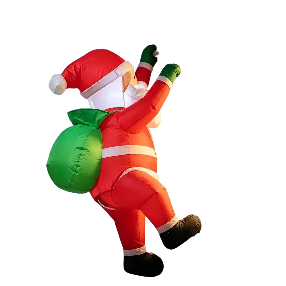 Inflatable dabbing santa claus yard decoration in red suit with white trim green sack and black boots standing outdoors