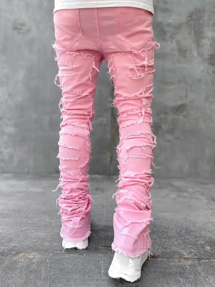 Men’s slim fit pink distressed denim jeans with frayed and ripped detailing for streetwear fashion