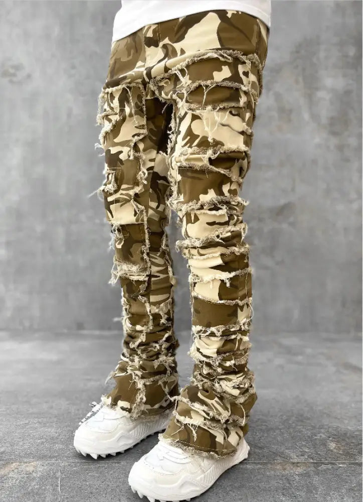 Men’s slim fit stacked ripped patchwork streetwear jeans in olive green and beige camouflage with distressed frayed edges