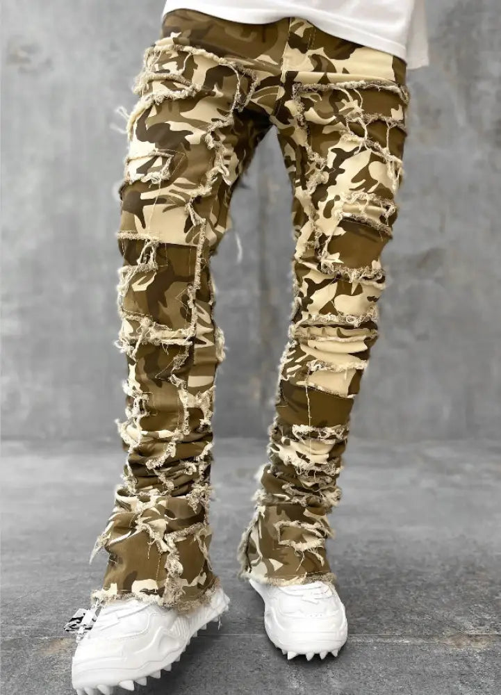 Men’s slim fit stacked ripped patchwork streetwear jeans in camouflage pattern with heavy distressing and frayed edges
