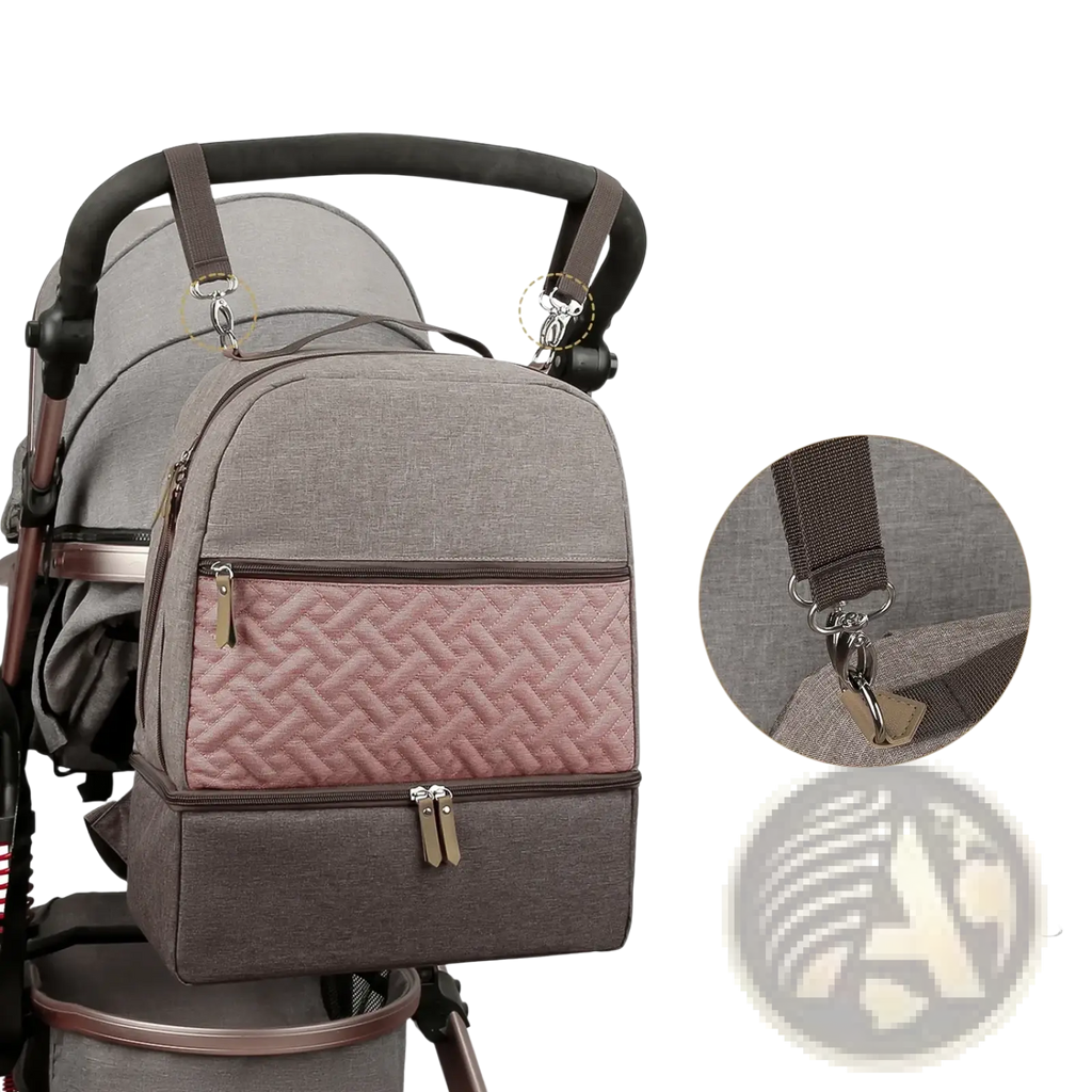 Insulated gray and pink quilted baby diaper backpack with brown zippers and metal hardware shown from the back side