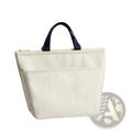 Cream-colored insulated oxford bento lunch bag with navy blue fabric handles and zipper closure