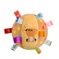 A soft orange plush interactive ball dog toy with stitched pug face colorful polka dots and attached ribbons handle