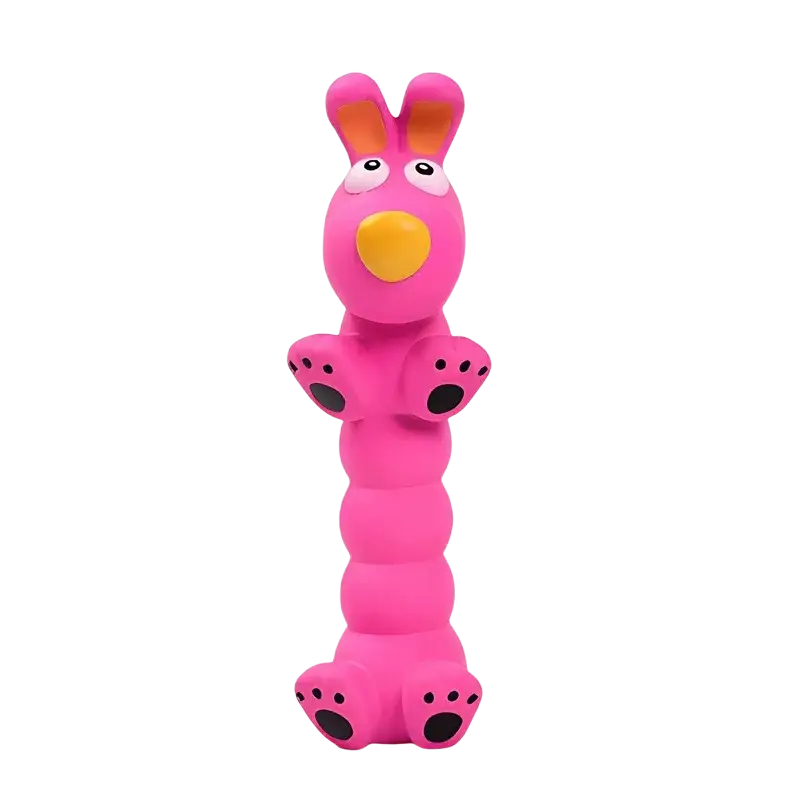 A bright pink rubbery bunny-shaped interactive dog chew toy with orange inner ears and a yellow nose made of latex