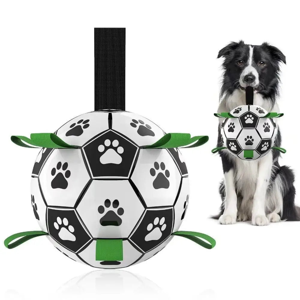 Interactive Halloween dog soccer ball toy in black and white with green paw print ribbons and a black handle grab tab