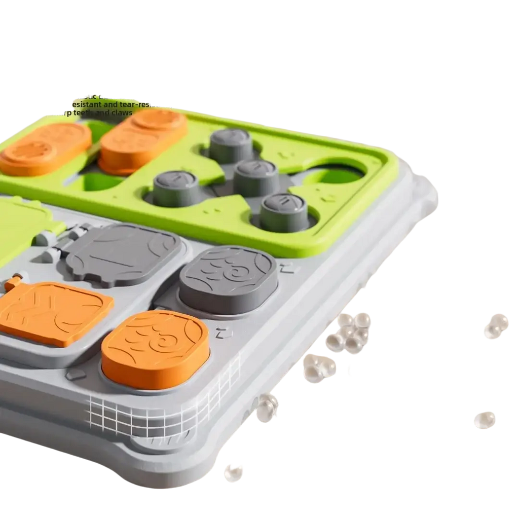 Bright green and gray plastic interactive dog puzzle feeder toy with orange and gray puzzle-like food dispensers