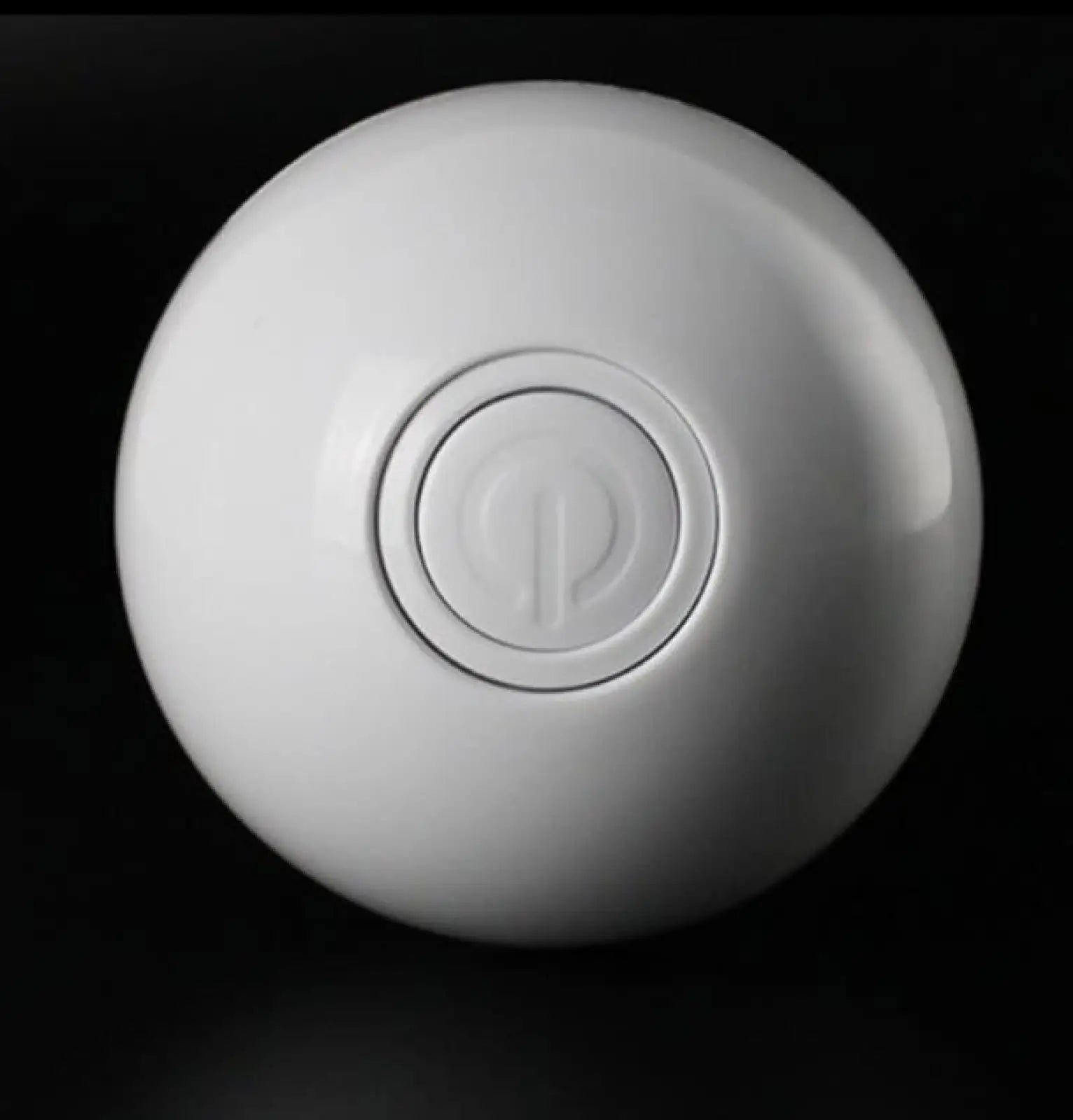 White glossy spherical interactive led cat toy ball with central power button featuring catnip and feathers