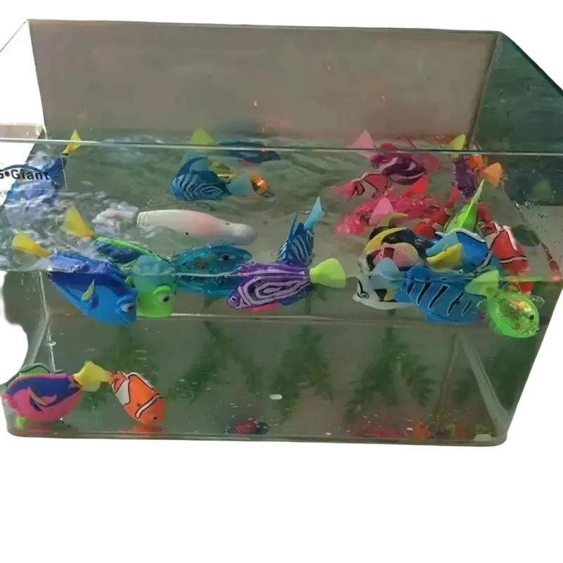 A colorful assortment of plastic interactive robotic fish cat toys swimming in a clear rectangular aquarium
