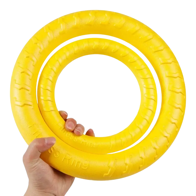 Bright yellow textured rubber interactive training pet ring with embossed branding for training and chewing