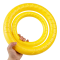 Bright yellow textured rubber interactive training pet ring with embossed branding for training pet ring puller use