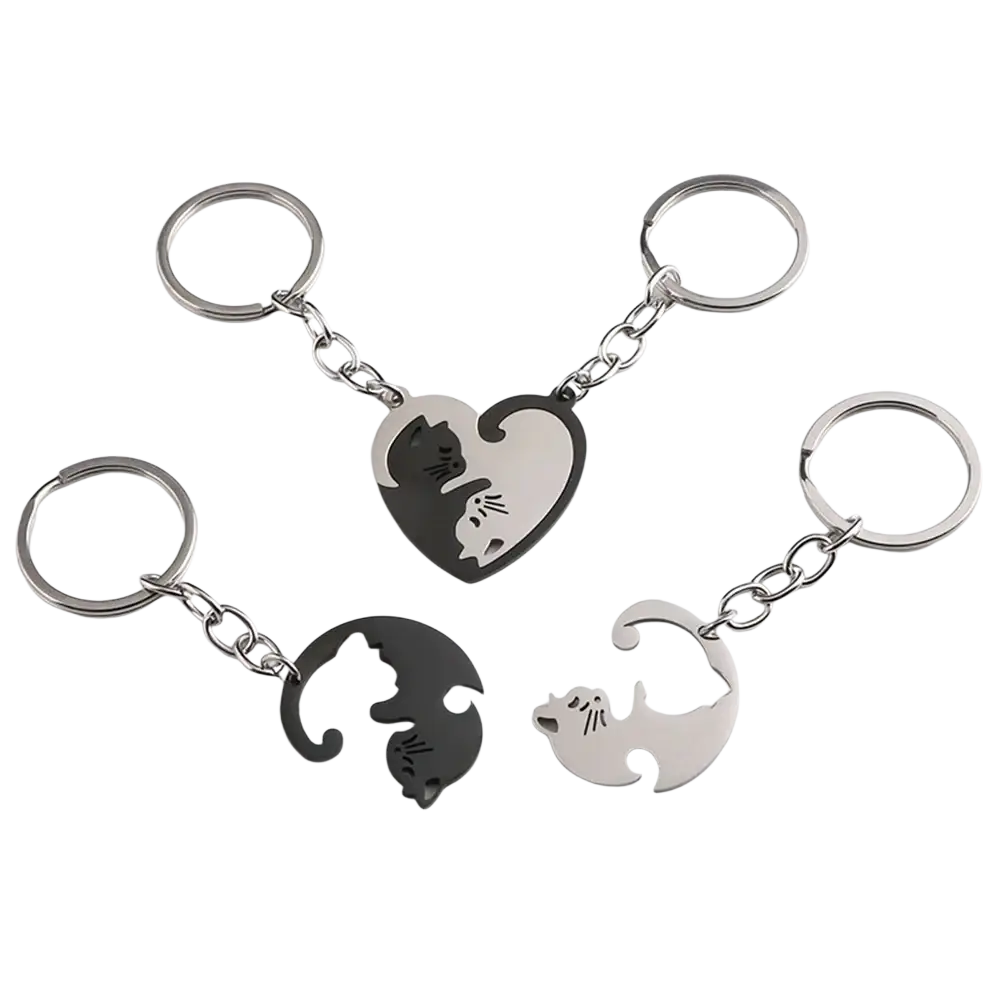 Set of four metallic cat-themed interlocking keychains with heart-shaped yin-yang design in black and silver finishes