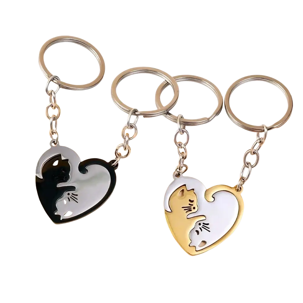 Heart-shaped interlocking cat couple keychain set in black silver and gold white metallic finishes