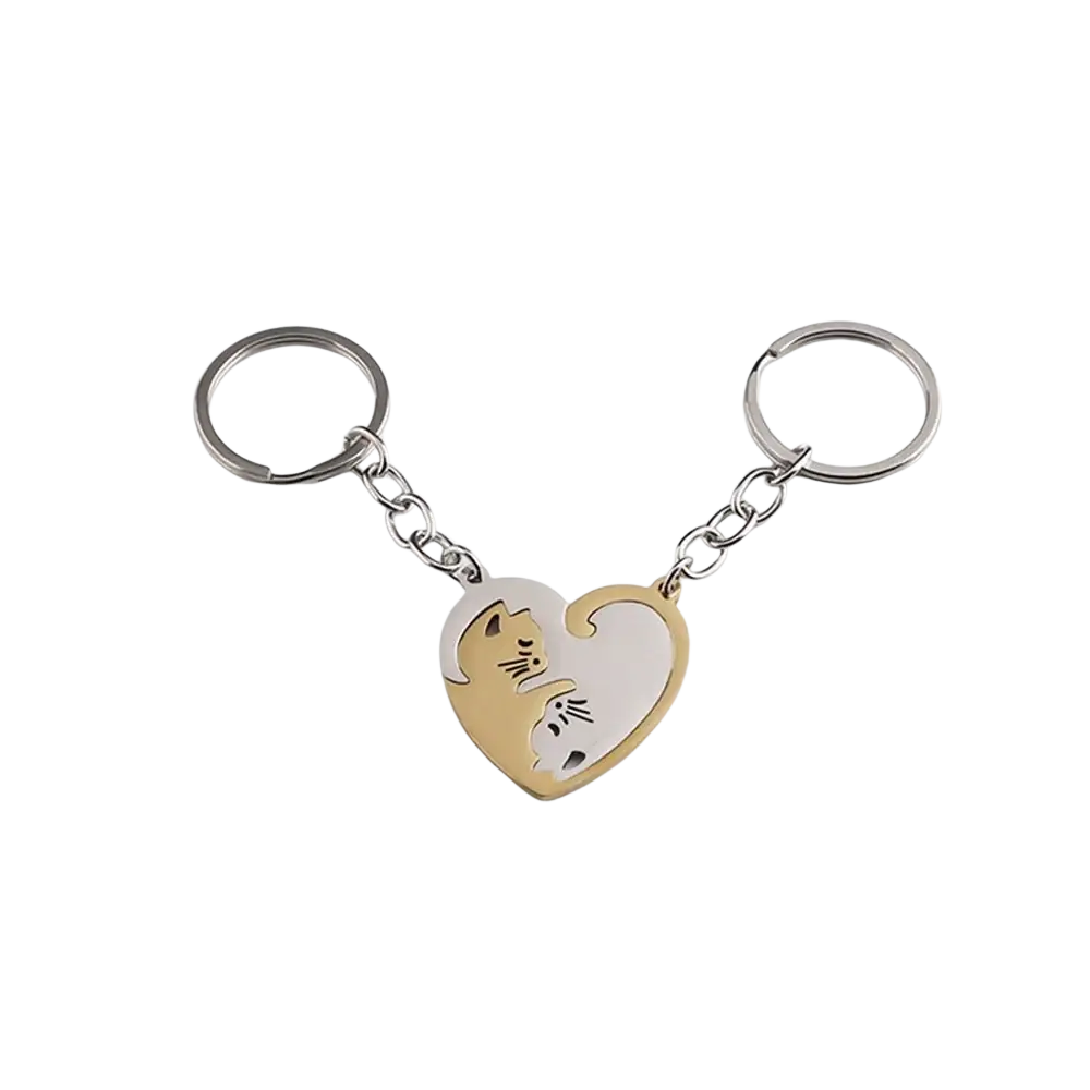 Two-tone metallic interlocking cat couple keychain set with heart-shaped yin-yang design in gold and silver colors