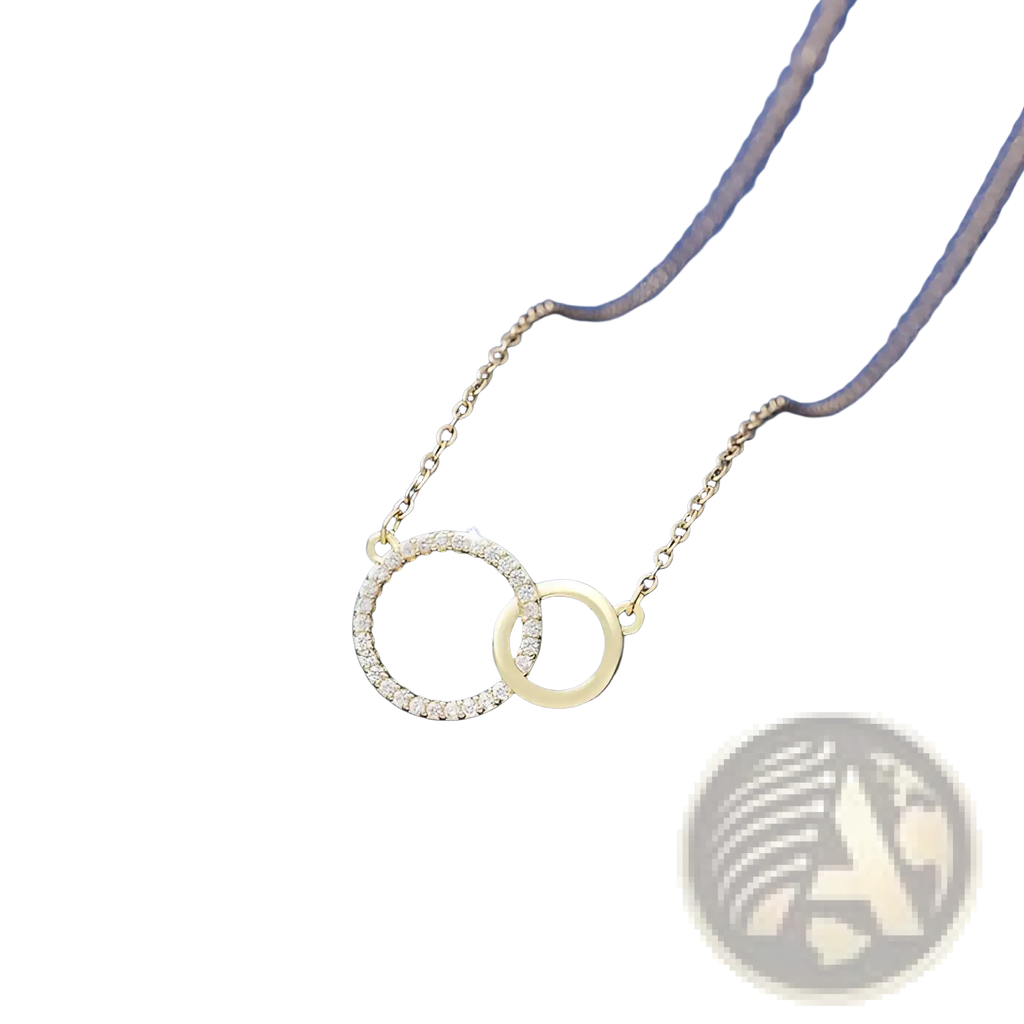 A delicate gold interlocking double circle pendant clavicle necklace with one circle adorned with sparkling diamonds
