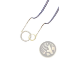 A delicate gold interlocking double circle pendant clavicle necklace with one circle adorned with sparkling diamonds