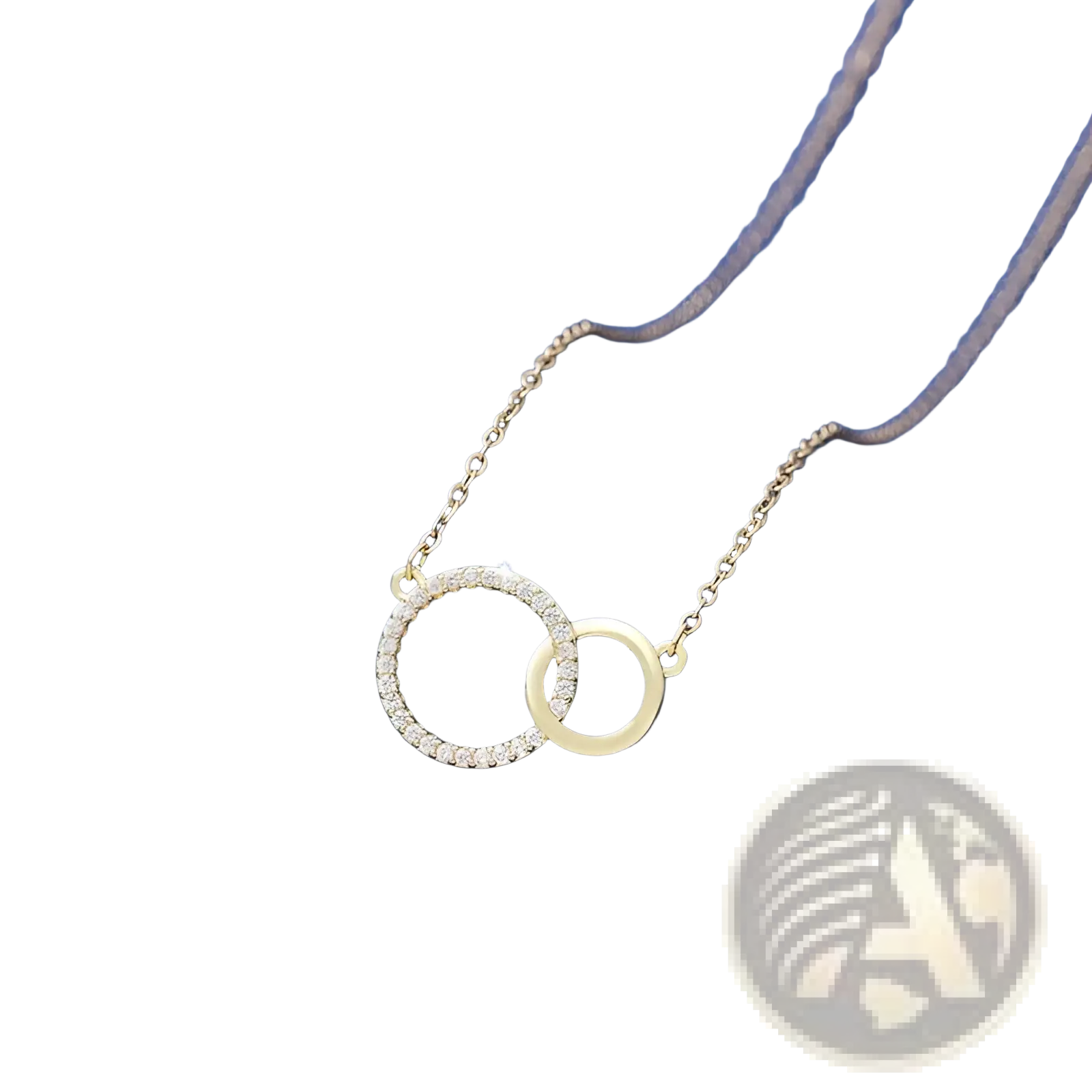A delicate gold interlocking double circle pendant clavicle necklace with one circle adorned with sparkling diamonds
