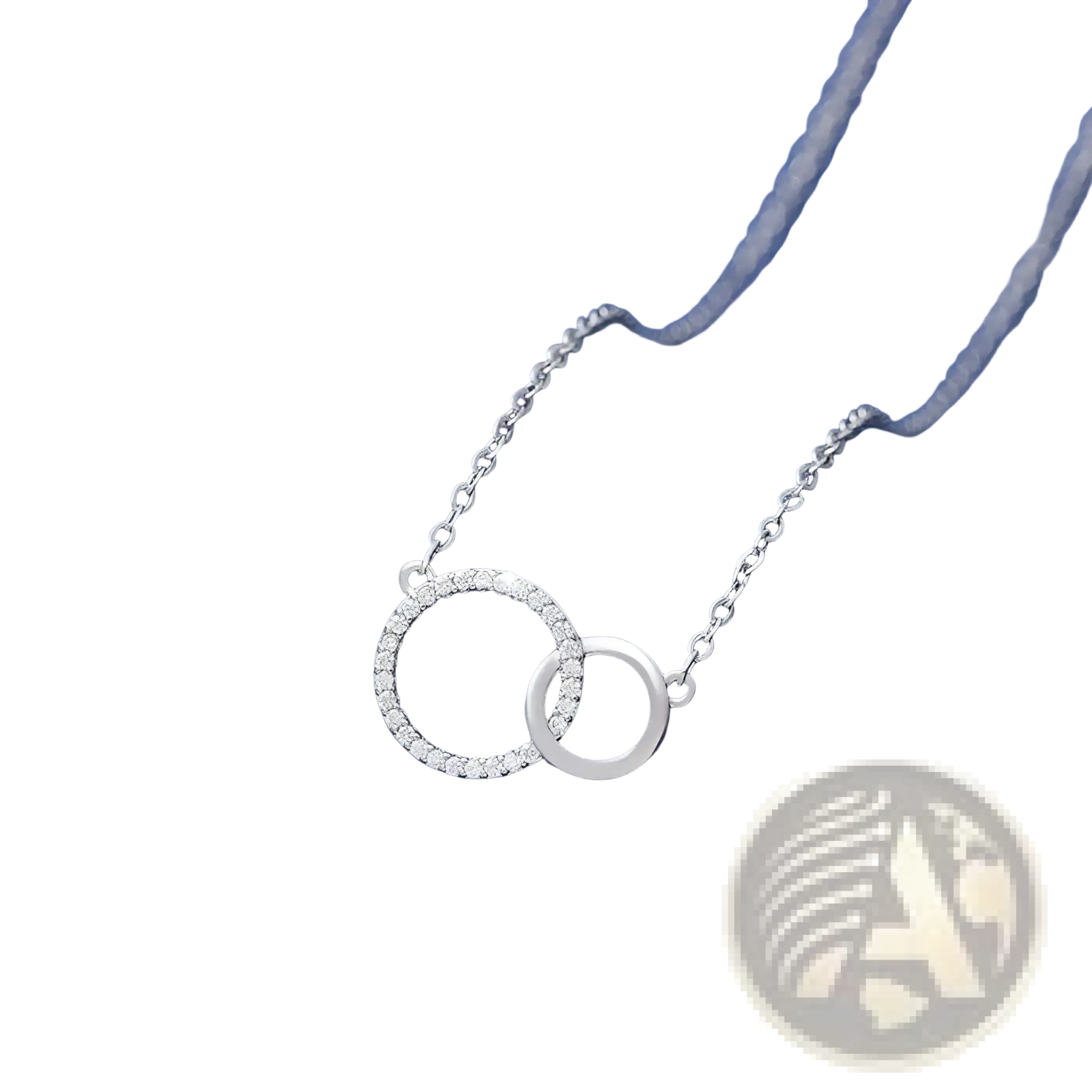 Silver interlocking double circle pendant clavicle necklace with one diamond adorned and one smooth circle on a delicate chain