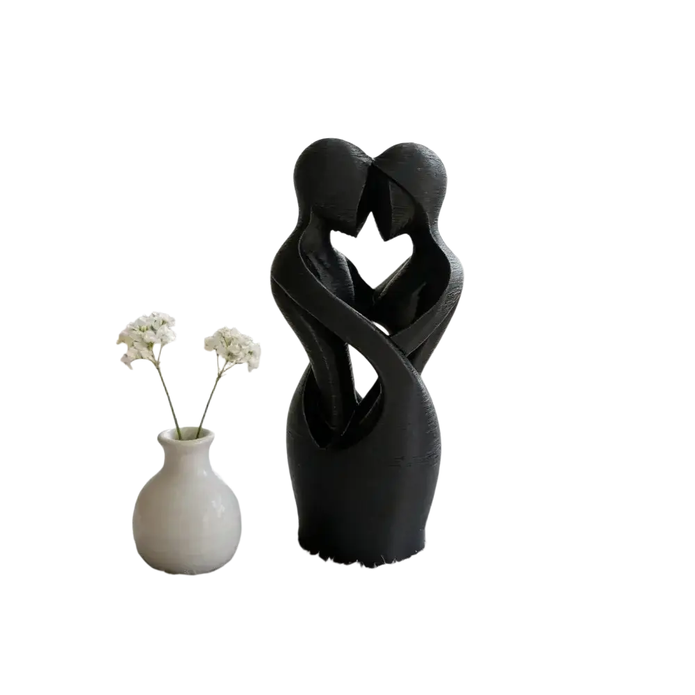 Black abstract sculpture of two intertwined figures forming a heart shape modern decor for home or office