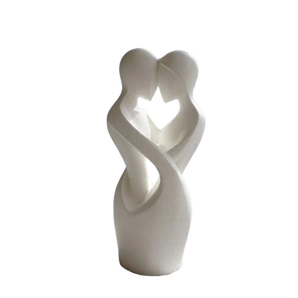White ceramic sculpture of two abstractly intertwined figures forming a heart shape modern decor piece