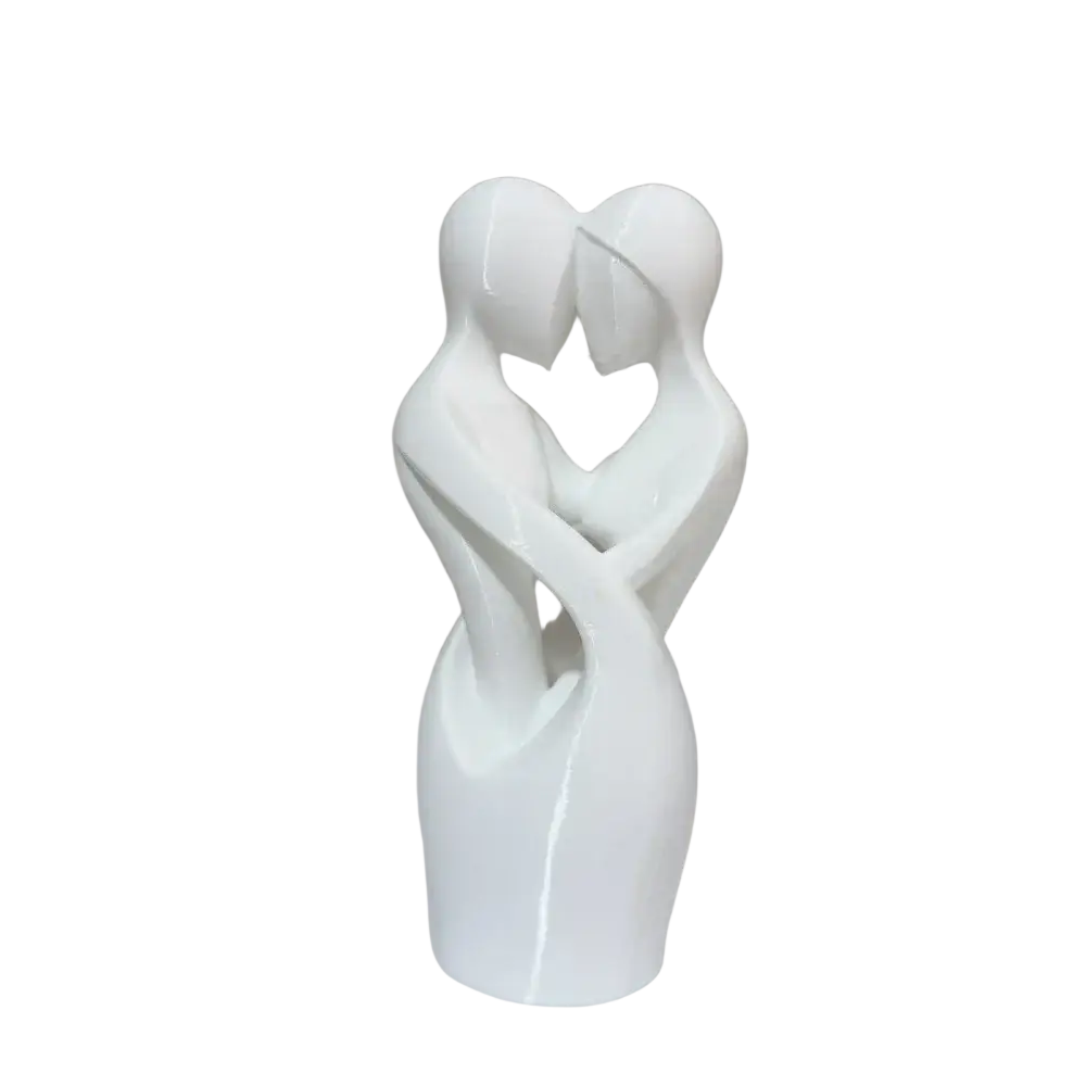 White ceramic sculpture of two abstract figures embracing to form a heart shape modern decor centerpiece