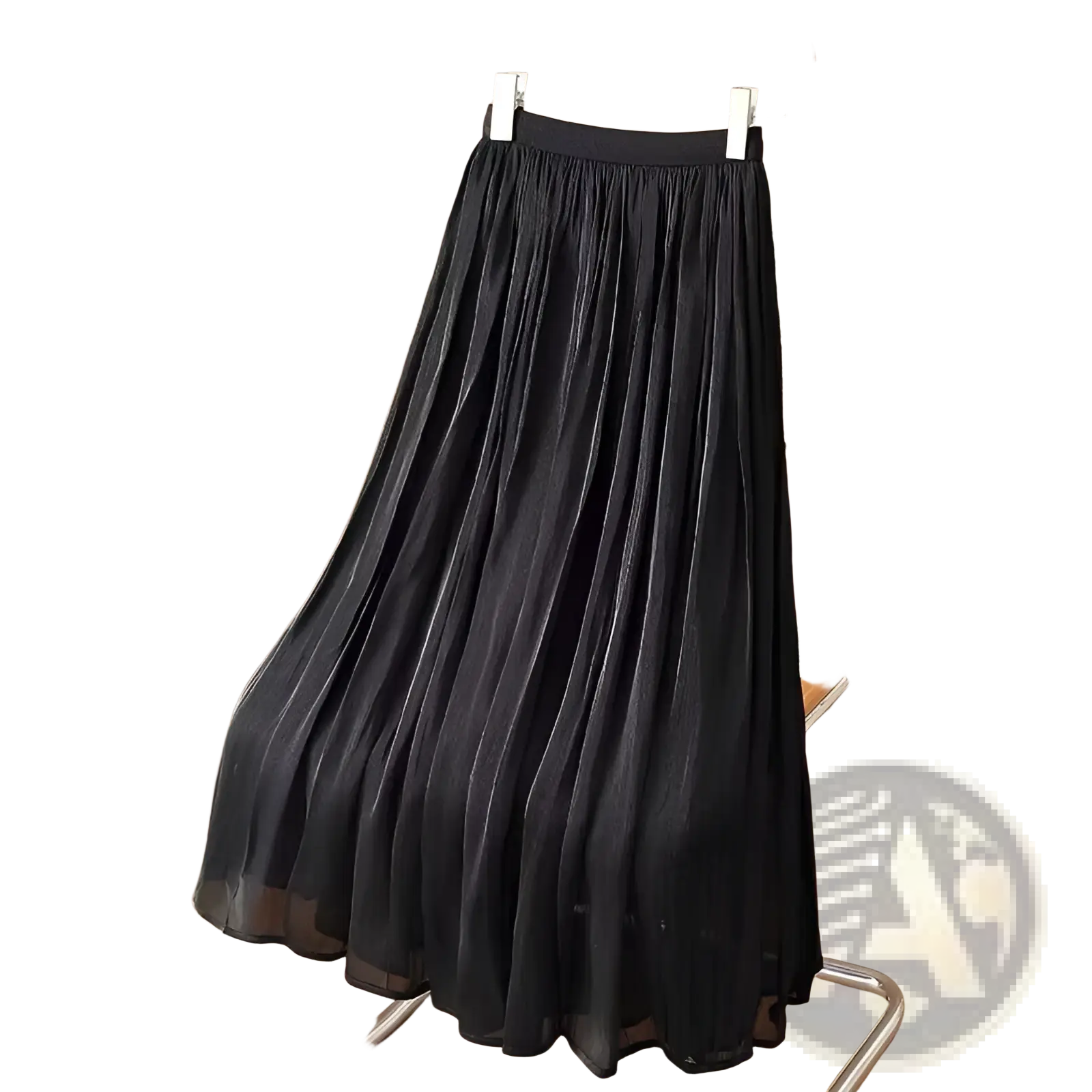 Black iridescent chiffon pleated midi skirt hanging on wooden hanger showcasing elegant fabric texture