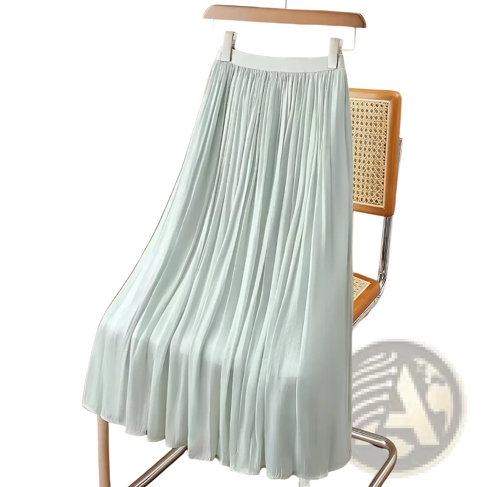 Iridescent chiffon pleated skirt in light mint green with white elastic waistband made of lightweight fabric