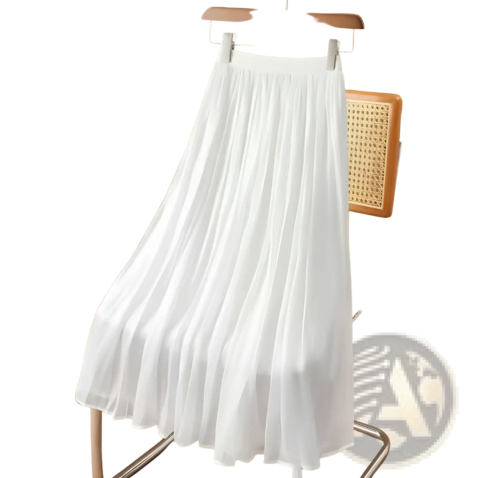 A flowing white iridescent chiffon pleated skirt made of lightweight sheer fabric hangs on a wooden hanger
