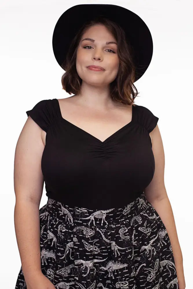 Black wide-brimmed hat paired with Isabel retro black sweetheart neckline top featuring vintage style and elegant silhouette