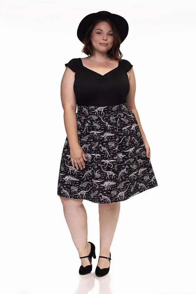 Black a-line skirt with white dinosaur silhouettes paired with isabel retro black sweetheart neckline top