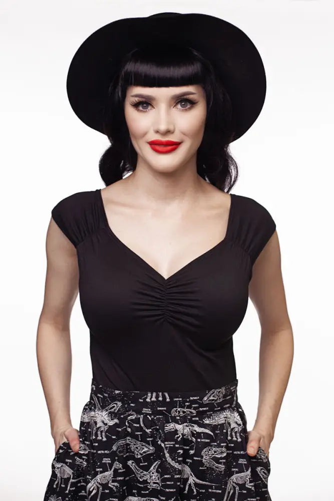 Black wide-brimmed hat with a sleek structured crown and soft curved brim paired with isabel retro black sweetheart neckline top