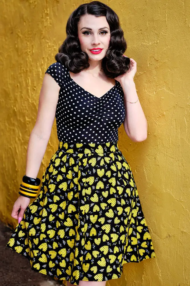 Isabel plus size polka dot sweetheart top in black with white dots fitted bodice and yellow bee patterned flared skirt
