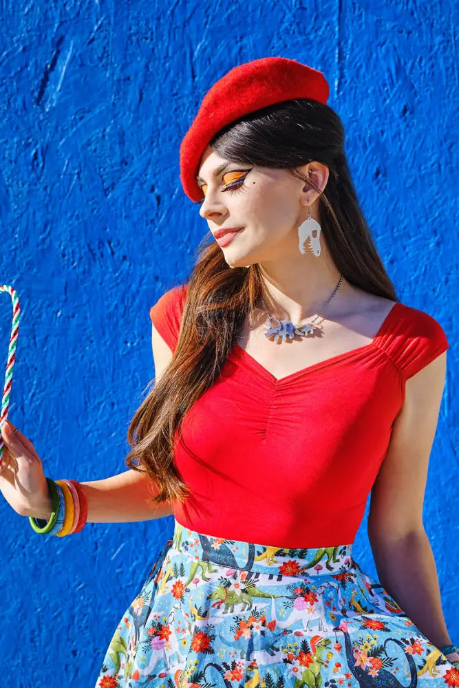 A vibrant red beret with a soft plush texture paired with the Isabel red sweetheart retro knit top