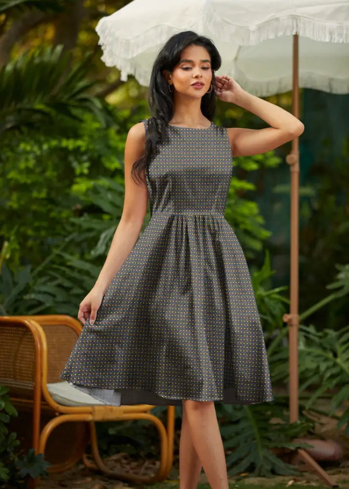 Isabella vintage 1950s sleeveless dark gray cotton midi dress with pockets featuring a subtle white dot pattern