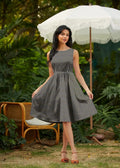 Isabella vintage 1950s sleeveless gray cotton midi dress with subtle white polka dots fitted waist and full skirt with pockets