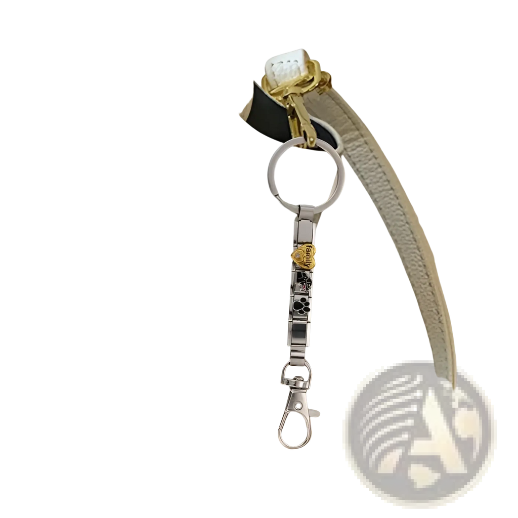 Italian link charm keychain in silver with gold rose charm and black paw print accents on white leather handbag strap