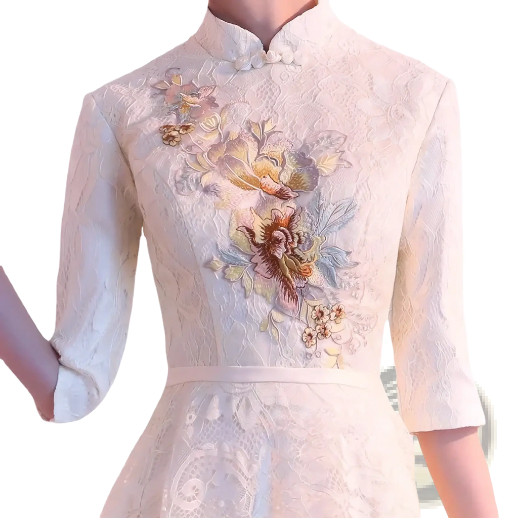 Ivory lace cheongsam wedding dress with intricate floral embroidery soft pastel hues and a traditional mandarin collar