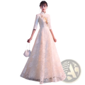 Elegant ivory lace cheongsam wedding dress featuring floral embroidery and a high collar for formal occasions