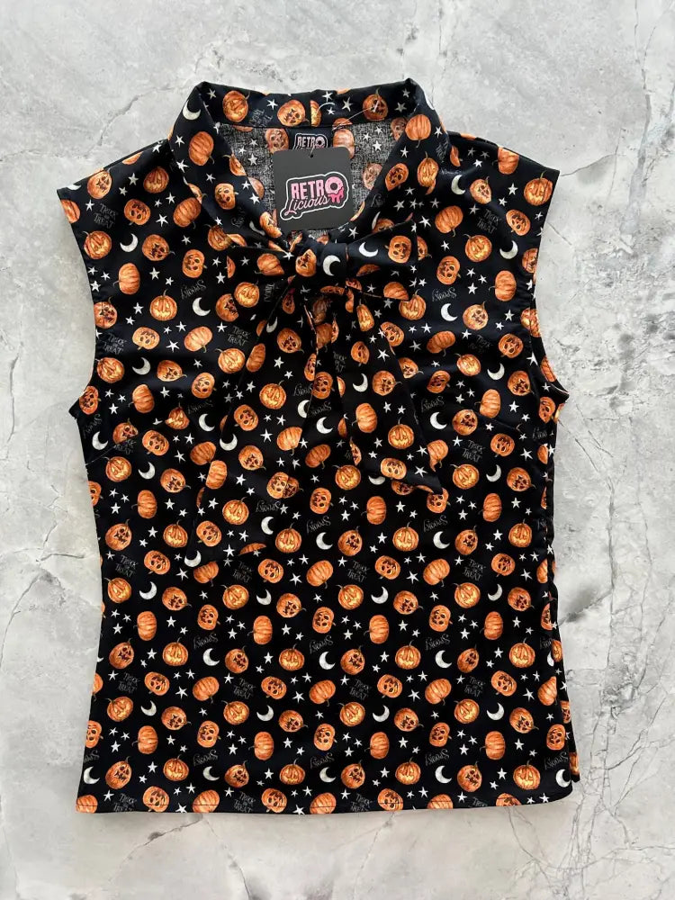 Black sleeveless cotton blouse with vintage jack-o-lantern bow neck and orange pumpkin skull and white moon motifs