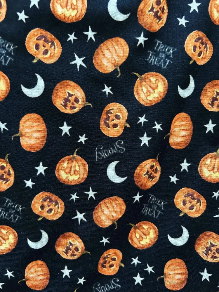 Black cotton sleeveless top with bow neck featuring orange jack-o-lanterns white stars moons and halloween text pattern