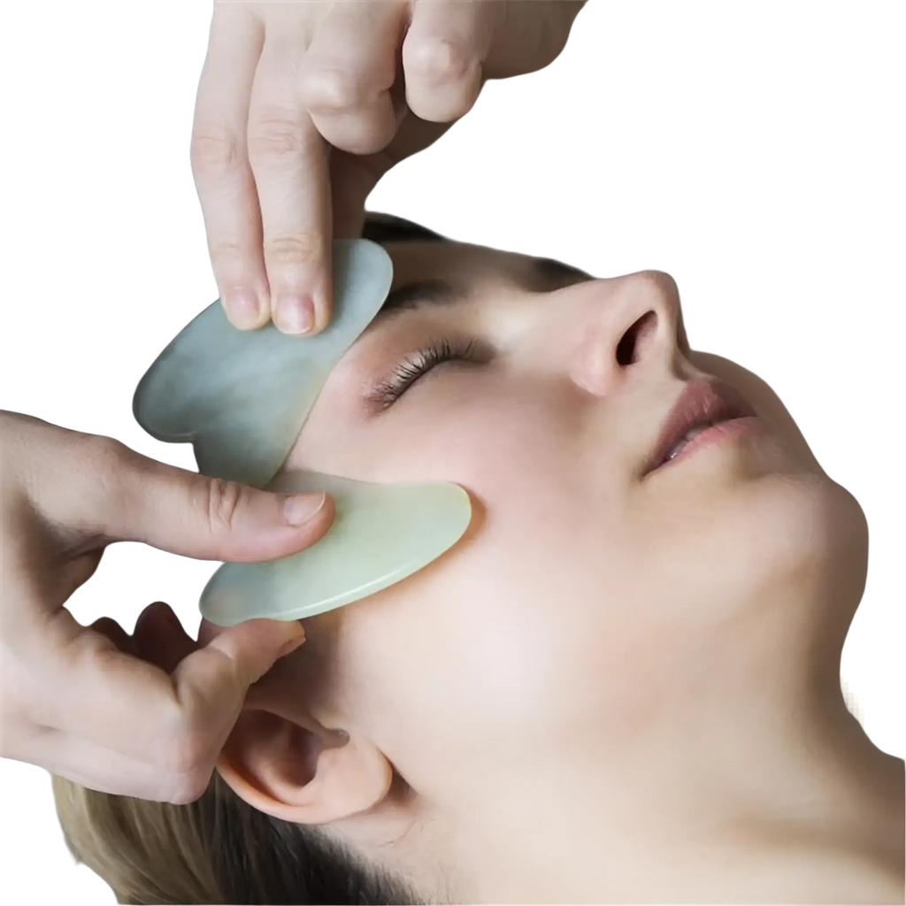 A translucent green jade gua sha facial massage tool with smooth polished edges and a slightly curved shape for skin care