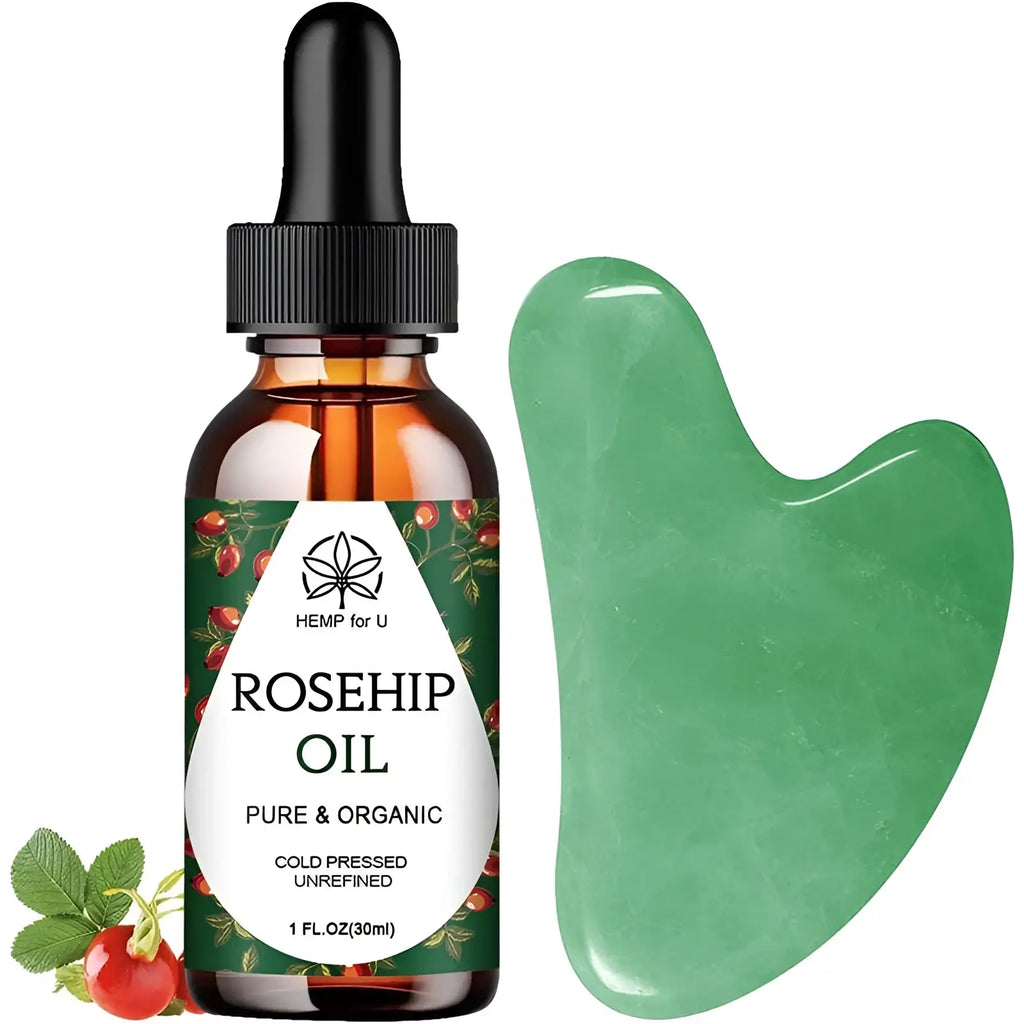 Bottle of pure rosehip oil in amber glass with black dropper and green jade gua sha facial massage tool for skincare