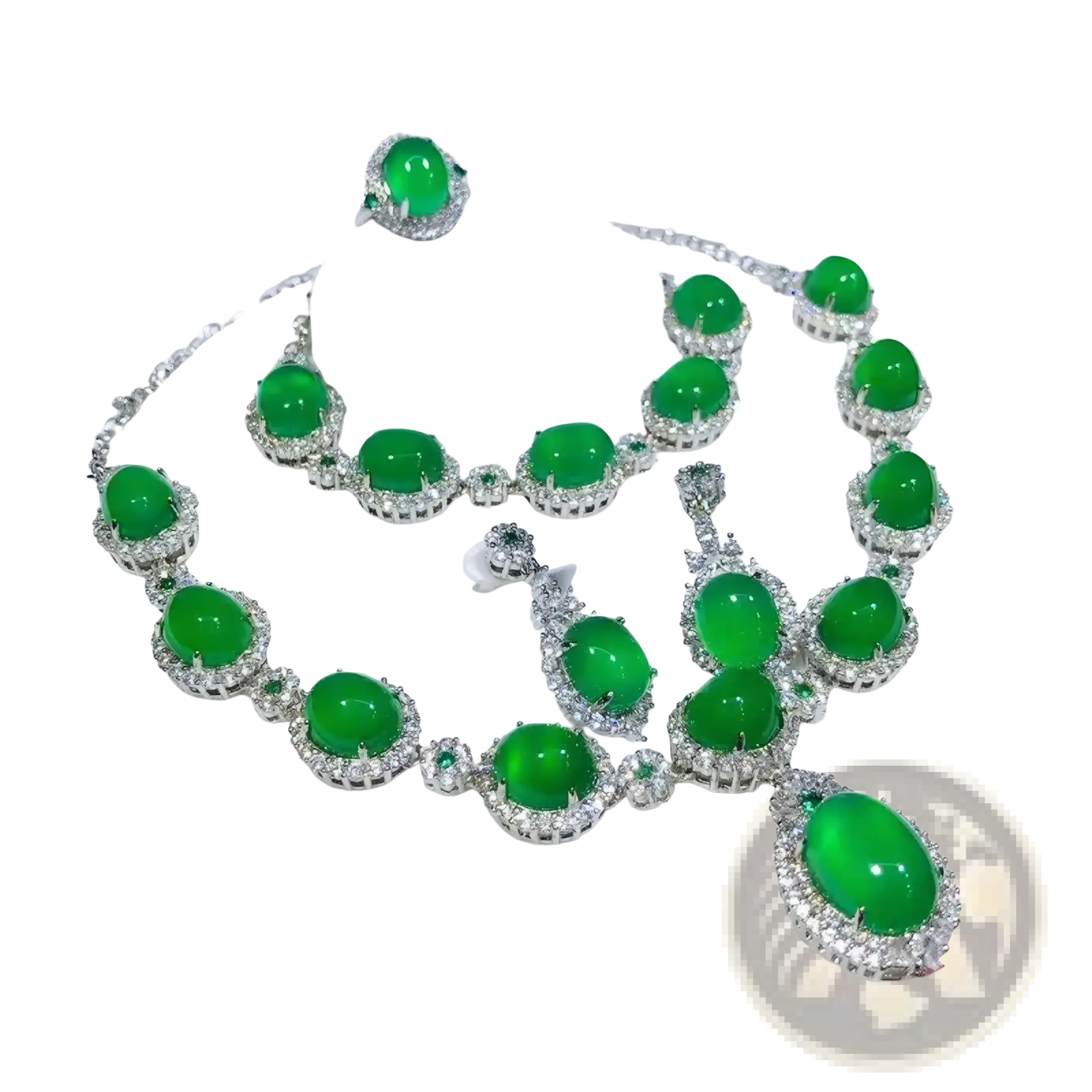 A jade jewelry set featuring vibrant green oval-cut jade and diamonds in 925 sterling silver bridal design