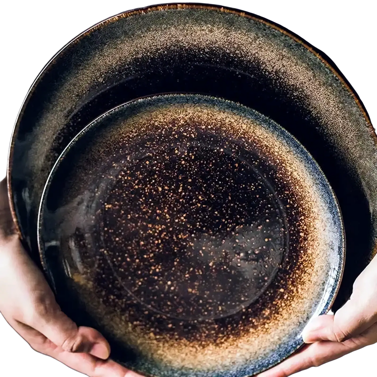 Two stacked Japanese ceramic dinner plates with dark speckled glaze and earthy brown rustic tableware accents