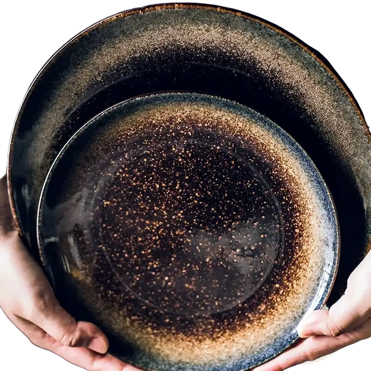 Two stacked Japanese ceramic dinner plates with dark speckled glaze and earthy brown rustic tableware accents