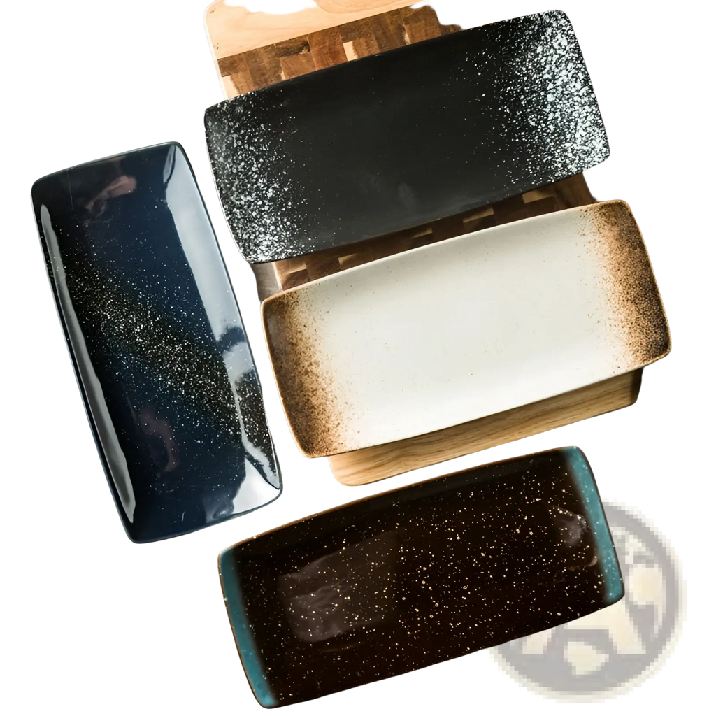 Set of four rectangular japanese ceramic sushi plates in glossy black white brown speckle and deep blue tones