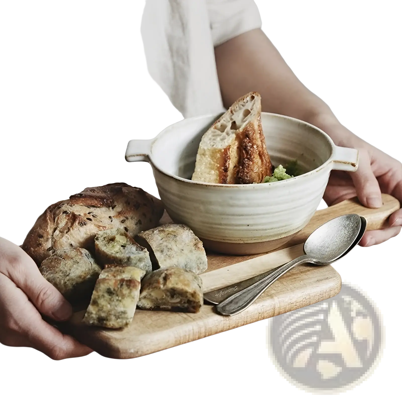 Cream-colored 6 inch binaural ceramic soup bowl made of japanese stoneware containing soup and toasted bread slice